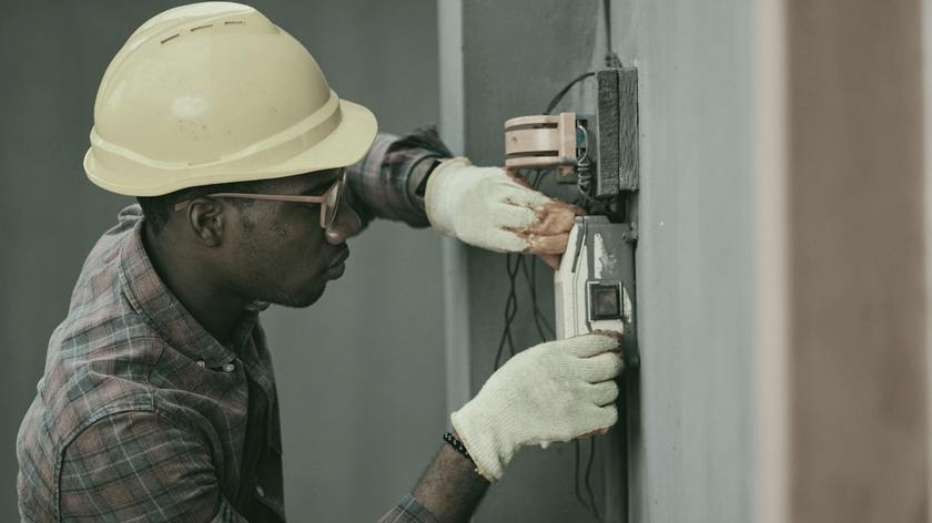 A Greencrest technician working on an electrical installation